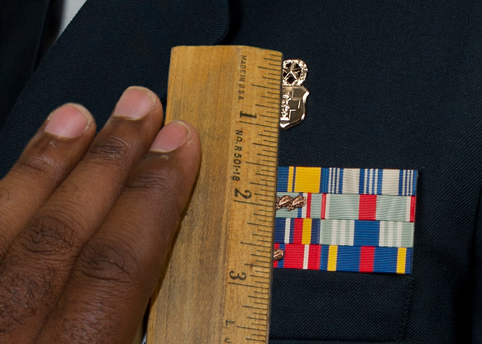 Maintaining a professional appearance at all times while in uniform is every servicemember’s responsibility. Airmen have Air Force Instruction 36-2903, Dress and Personal Appearance, to assist them in sustaining a professional image. (U.S. Air Force photo illustration by Senior Airman Kasey Close/Released)