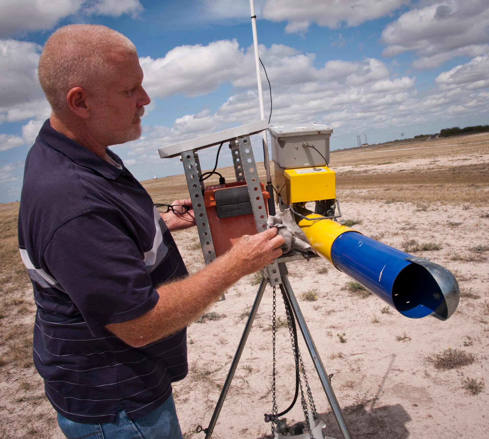 Grover Lemarr, aircraft flight safety manager, inspects the improvements he made to a Laughlin bird-scare cannon. Lemarr's idea to improve the solar panels that power the cannons was recognized by Col. Tom Murphy, 47th FTW commander, for saving the Air Force an estimated $75,000. (U.S. Air Force Photo/Airman 1st Class Nathan Maysonet)