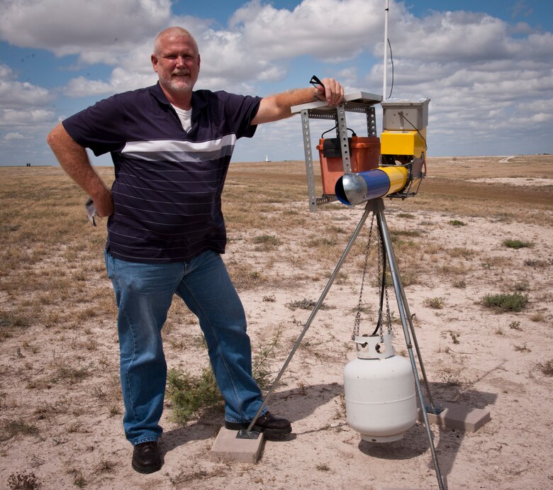 Grover Lemarr, aircraft flight safety manager, stands with one of Laughlin's flight line bird-scare cannons. Lemarr's idea to improve the solar panels that power the cannons was recognized by Col. Tom Murphy, 47th FTW commander, for saving the Air Force an estimated $75,000. (U.S. Air Force Photo/Airman 1st Class Nathan Maysonet)