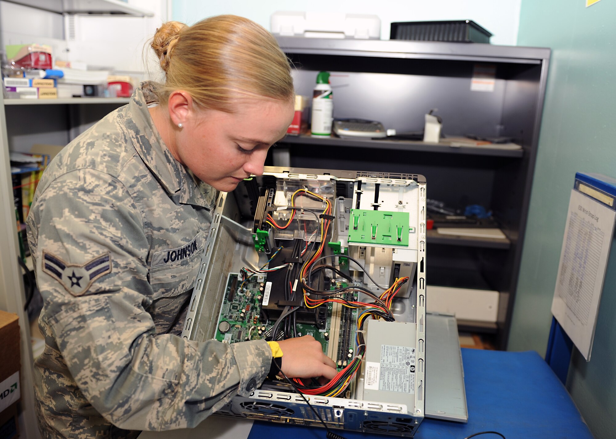 Airman 1st Class Michelle Johnson, a 19th Communications Squadron Cyber Systems Apprentice,trouble shoots a computer Sept. 24, 2012, at Little Rock Air Force Base, Ark. Johnson's key duties include computer maintenance, updating software programs, and computer installations for all of Team Little Rock. (U.S. Air Force photo by Staff Sgt. Jessica Condit)