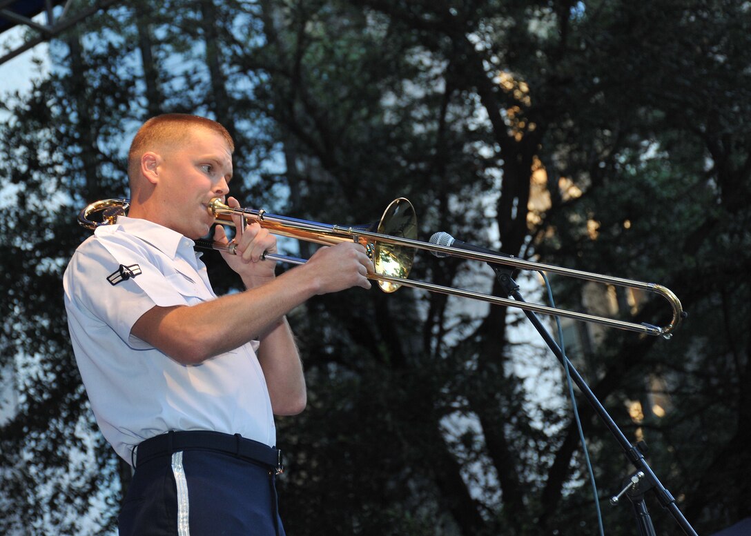 A1C Jaime Parker performs a trombone solo in Travis Park for the 2012 Jazz SA Live Festival in San Antonio, TX. 