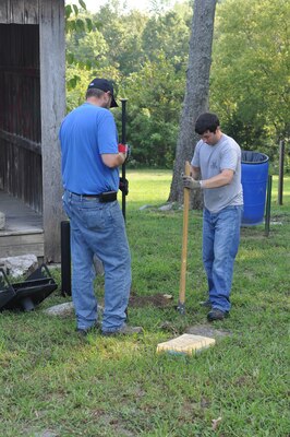 2012 EAGLE Class participants dig a grill post hole at one of the campsites within Cordell Hull Lake’s horseback riding primitive campground Sept. 11, 2012. (USACE photo by Amy Redmond)