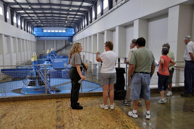 Charlotte Stenger (Left), park ranger at U.S. Army Corps of Engineers Nashville District’s Lake Barkley, briefs visitors during their June 23, 2012 tour of the Barkley Power Plant. Public access to this area had been restricted since the 9-11 terrorist attacks. (USACE photo by Fred Tucker)