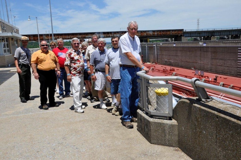 (Left to right) Park Ranger Kayl Kite and Mark Abshire, lock master, stand with visitors above the U.S. Army Corps of Engineers Nashville District’s Lake Barkley Lock chamber June 23, 2012. This is one of four groups that attended a Barkley open house and toured the lock and power plant. (USACE photo by Fred Tucker)