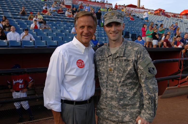 Maj. Patrick Dagon (Right), U.S. Army Corps of Engineers Nashville District deputy commander, meets Tennessee Gov. Bill Haslam at the Nashville Sounds game June 14, 2012. The major threw out the first pitch in honor of the Army's birthday. (USACE photo by Leon Roberts)