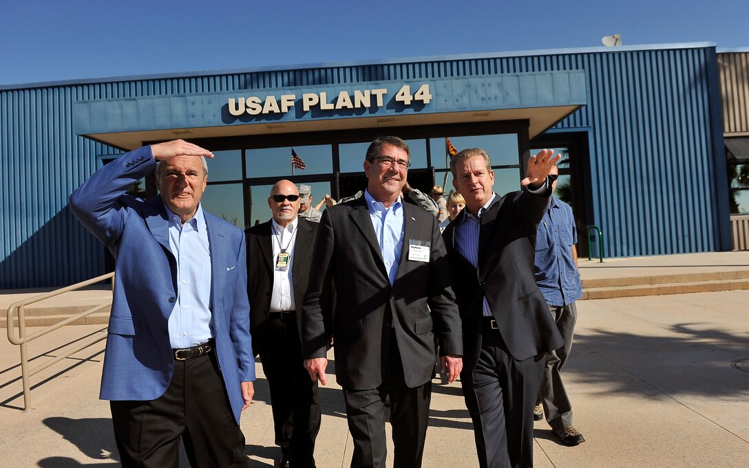William H. Swanson, left, chairman and CEO of Raytheon Co., and Taylor Lawrence, right, Raytheon vice president, give Deputy Defense Secretary Ashton B. Carter, center foreground, a tour of the company’s facilities by in Tucson, Ariz., Sept. 26, 2012.