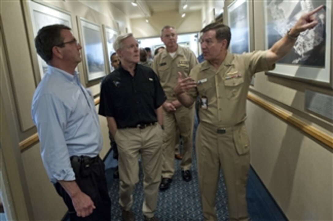 Deputy Secretary of Defense Ashton B. Carter, left, and Secretary of the Navy Ray Maybus, center, are given a tour of the Commander, Naval Air Forces headquarters by Vice Adm. Allen G. Myers, right, during a visit to San Diego, Calif., on Sept. 26, 2012.  