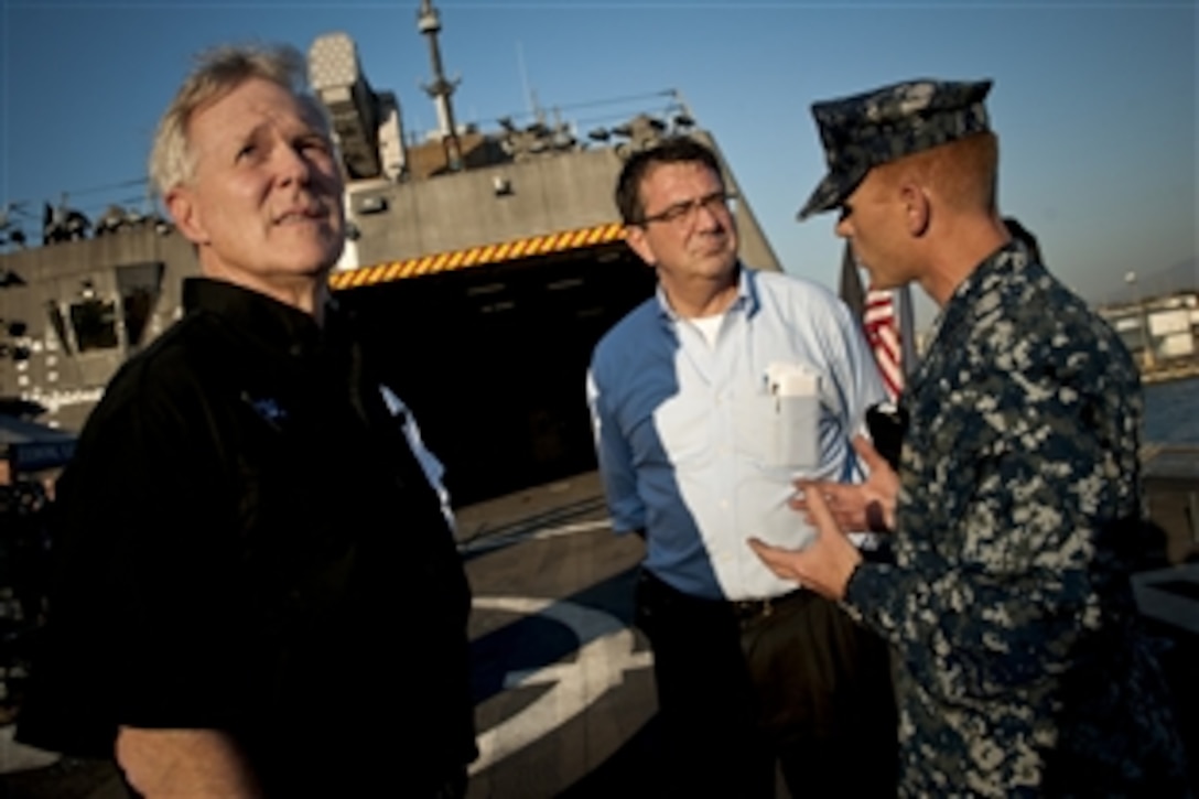 Deputy Defense Secretary Ashton B. Carter, center, and Navy Secretary Ray Mabus, left, visit with Navy Cmdr. Tim Wilke, commanding officer of USS Freedom, during a visit to the ship in San Diego, Sept. 26, 2012. 
