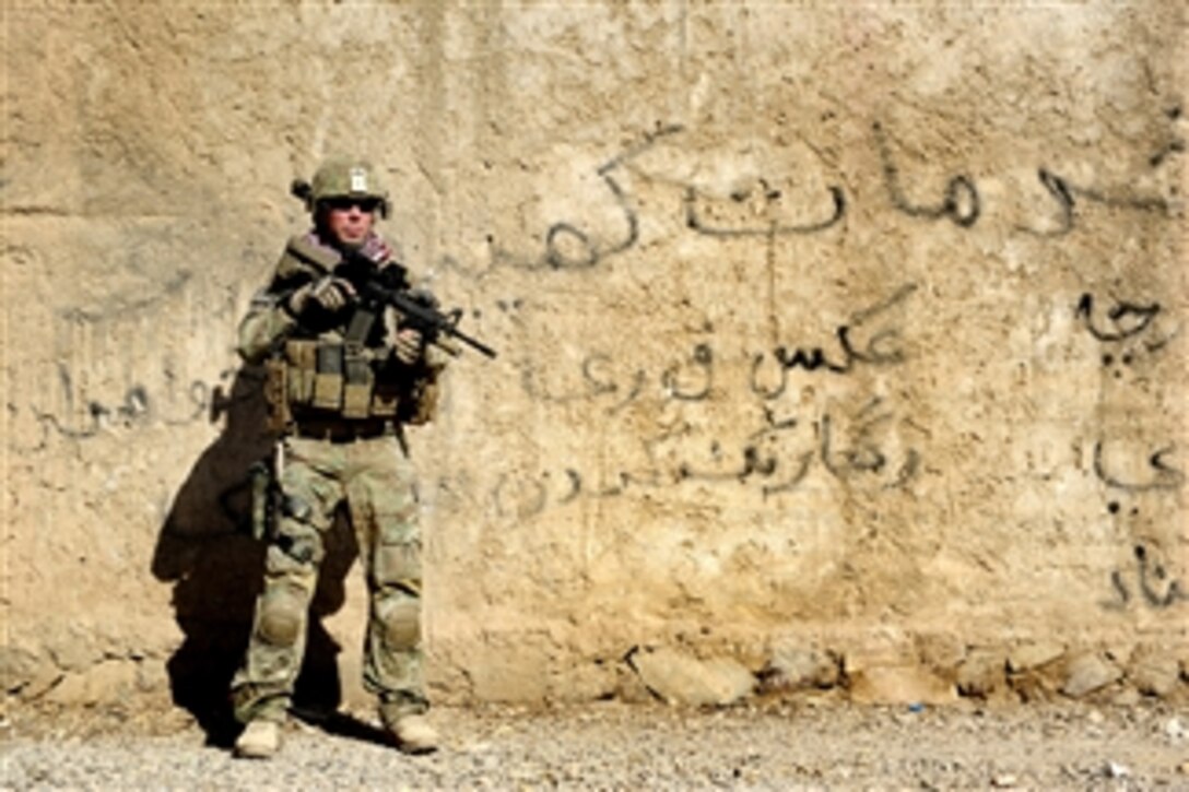 U.S. Army Staff Sgt. James Bates provides security during a mission to the director of information and culture's office in Farah City, Afghanistan, on Sept. 25, 2012. Bates is attached to the Provincial Reconstruction Team Farah.  