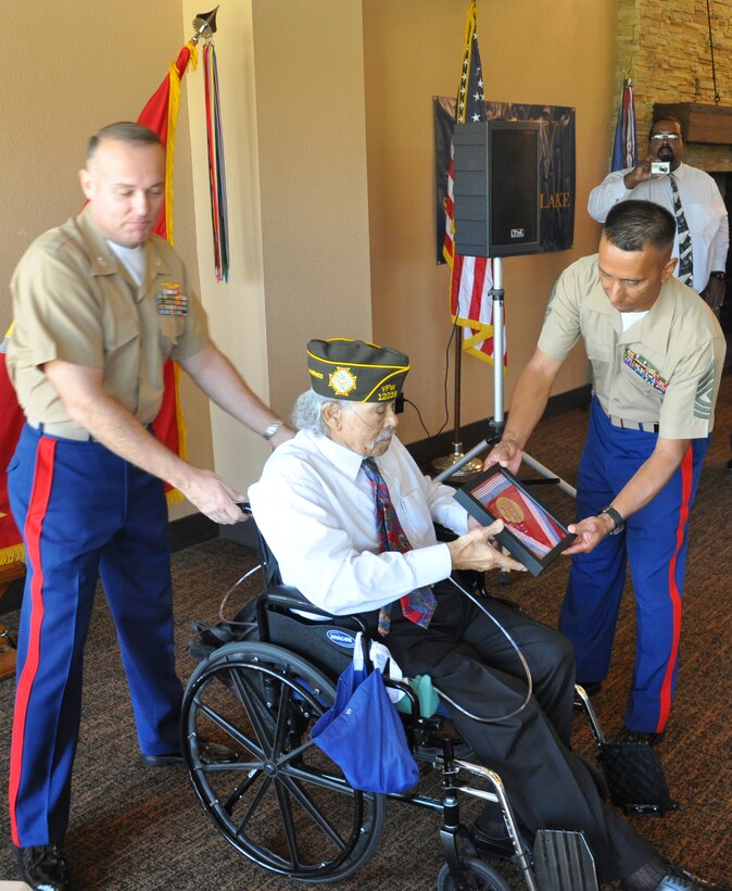 First Sergeant Arthur Hernandez, presents Montford Point Marine Sgt. William L. Land the Congressional Gold Medal, Sept. 16, in Victorville, Calif. Land served honorably in the United States Marine Corps from 1943-1946. During his time in the Corps, Land participated in the Island Hopping Campaign in the Pacific during World War II.