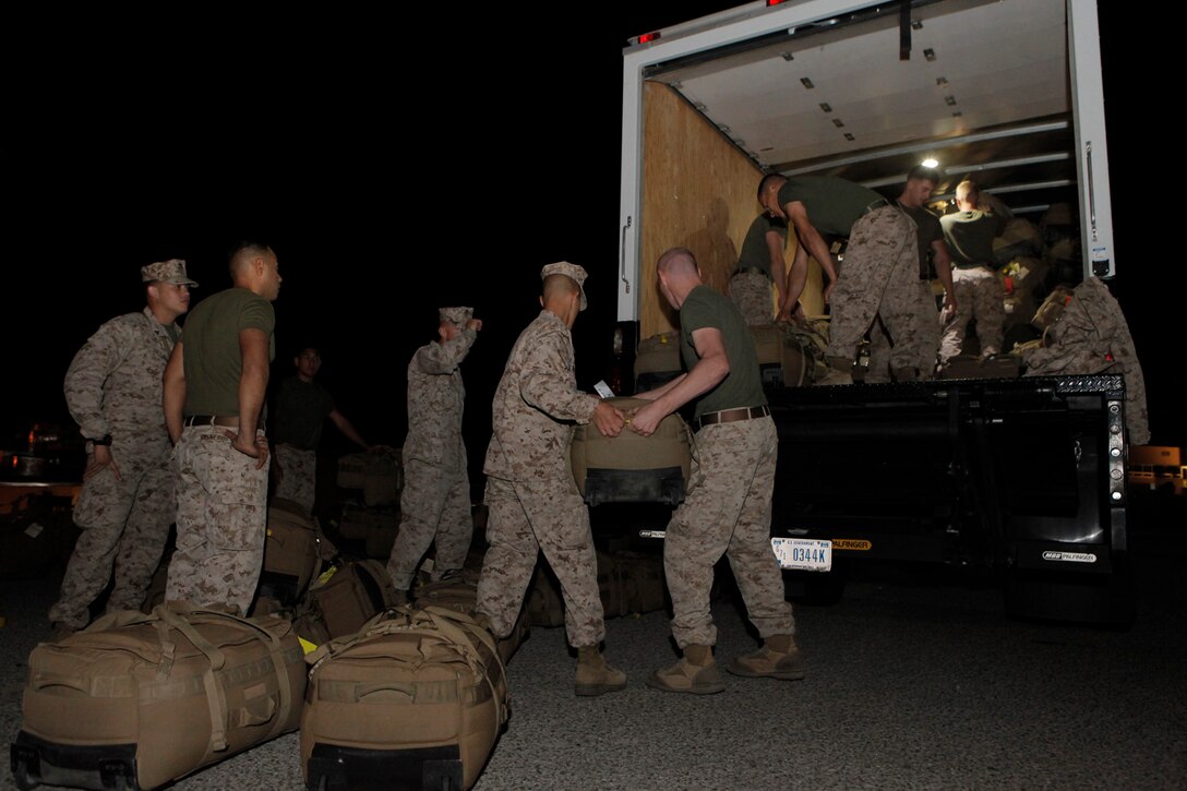 U.S. Marines assigned to Regimental Combat Team 7 (RCT-7), load gear at Marine Corps Air Ground Combat Center, Twentynine Palms, Calif., Sept. 26, 2012. RCT-7 is embarking on year long deployment to Afghanistan in support of Operation Enduring Freedom. (U.S. Marine Corps photo by Cpl. Alejandro Peña/Released)