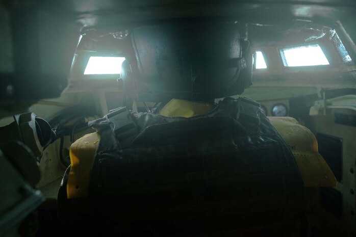Lance Cpl. Henry Terriquez, an Amphibious Assault Vehicle crewman, with 3rd Assault Amphibian Battalion, 1st Marine Division, drives an AAV during a mock ship to shore operation aboard the USS Makin Island September 6.