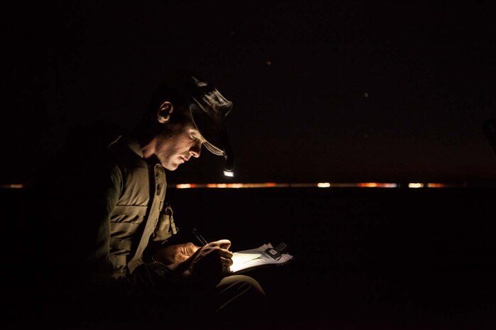 Sgt. Garrett Baresel, an Amphibious Assault Vehicle crewman, with 3rd Assault Amphibian Battalion, 1st Marine Division, compiles the evenings fire watch roster during a mock ship to shore operation on Camp Pendelton, Calif. September 6.