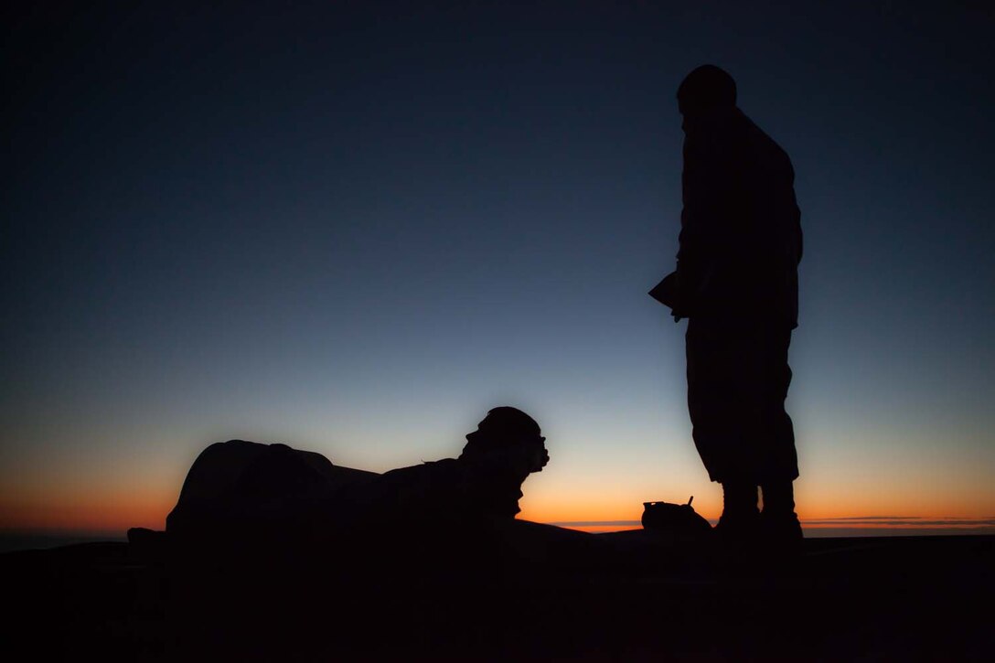 Refueling Marines wait to refuel the next Amphibious Assault Vehicle during a mock ship to shore operation Sept. 6 on Camp Pendelton Calif.