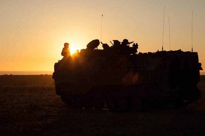 Lance Cpl. Henry Terriquez, an Amphibious Assault Vehicle crewman, with 3rd Assault Amphibian Battalion, 1st Marine Division, monitors the radio during a mock ship to shore operation on Camp Pendelton, Calif. September 6.