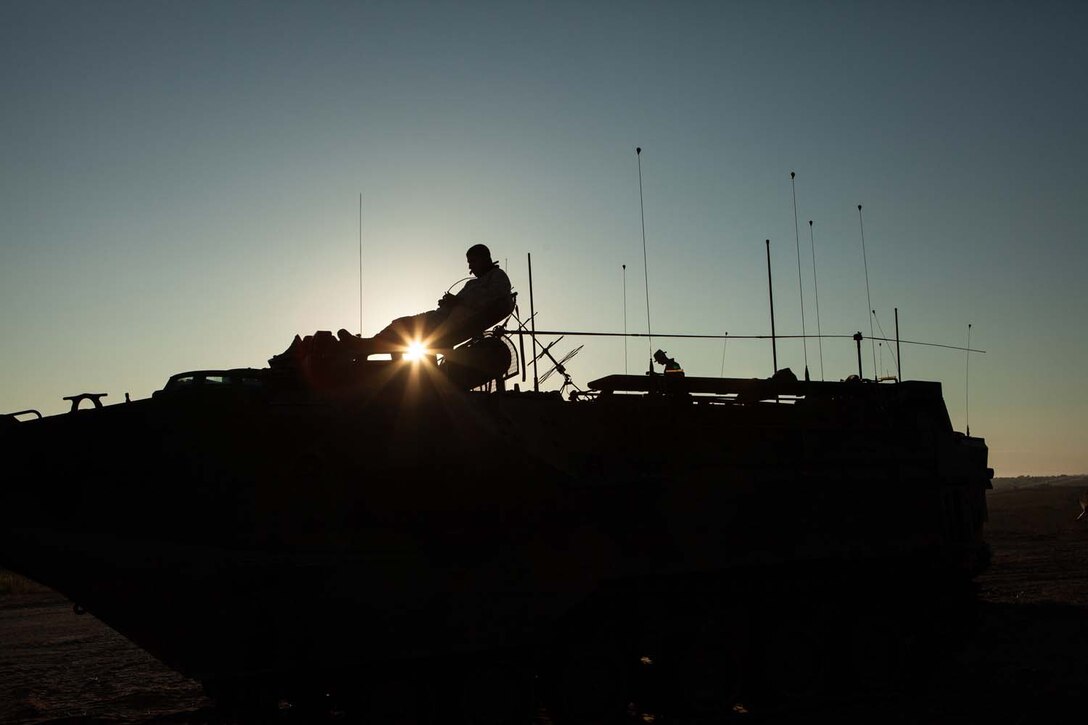 A Marine with 3rd Assault Amphibian Battalion, 1st Marine Division, moniters the radio during a mock ship to shore operation on Camp Pendelton, Calif. September 6.