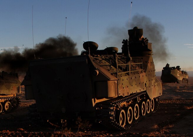 Amphibious Assault Vehicles with Company D, 3rd Assault Amphibian Battalion maneuver throughout the Acorn Training Area Dec. 9. The company reacquainted themselves on AAVs after deploying several times as provisional infantry units. 