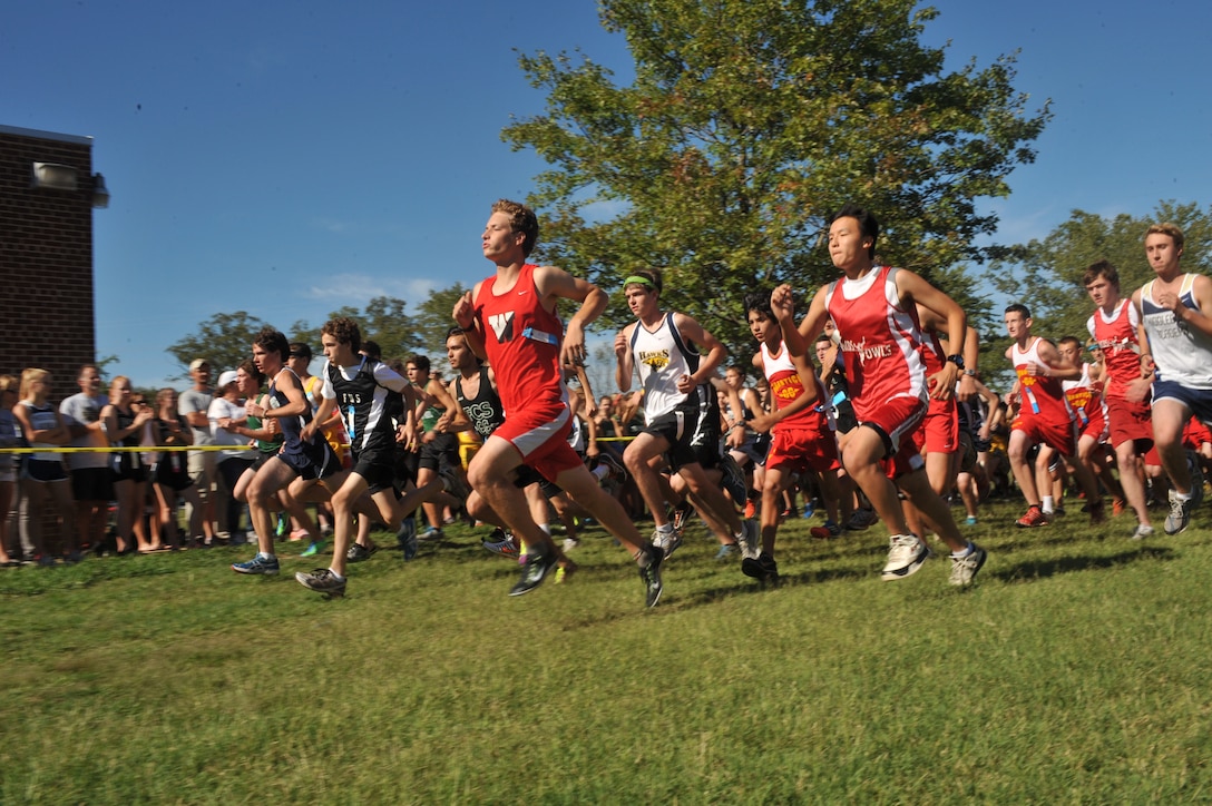 Runners burst out of the gate at the start of the Quantico Middle/High School Cross Country Invitational at John H. Russell Elementary School on Sept. 11. Fifteen other high schools, were a part of the invitational.
