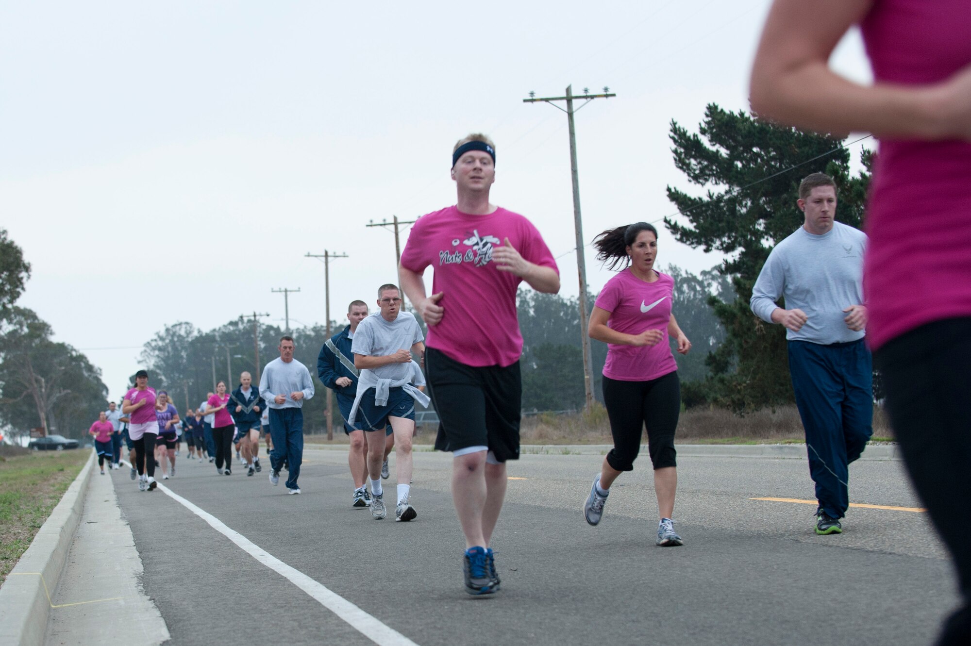 VANDENBERG AIR FORCE BASE, Calif. -- To kick off the month of October, Team V ran a 5K wearing pink and purple for Breast Cancer Awareness and Domestic Violence Awareness Month at the parade grounds here Friday, Sept. 28, 2012. (U.S. Air Force photo by Senior Airman Lael Huss)