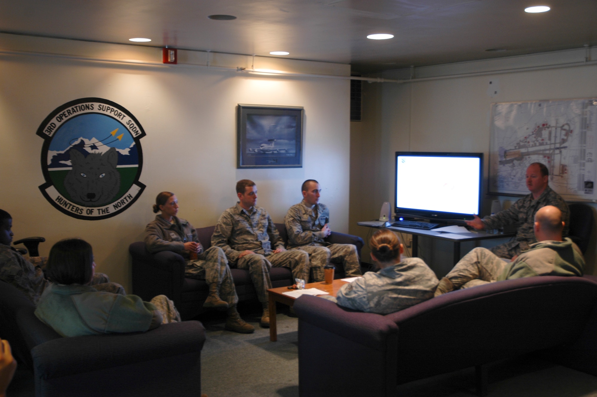 Master Sgt. Cary Adcock briefs members of the 3rd Operations Squadron 28 September about the Comprehensive Airmen Fitness program. This is in support of the 3rd Wing's Safety Day activities, targeted at creating time for Airmen to focus on resiliency and overall safety issues. (U.S. Air Force photo/1st Lt. Matthew Chism)