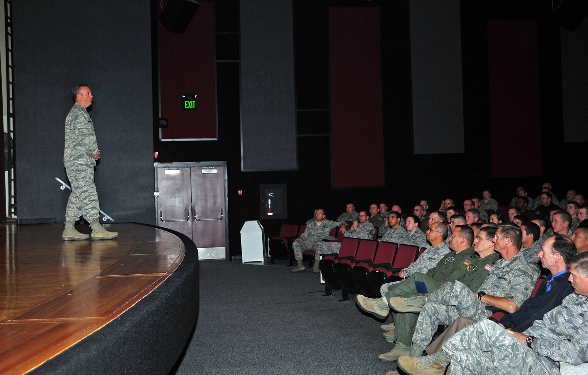 Col. Brian Newberry, the 92nd Air Refueling Wing commander, addresses members of Team Fairchild in the base theater during his first set of commander’s calls as the 92nd ARW commander Sept. 27, 2012 at Fairchild Air Force Base, Wash. Newberry gave background information about himself and about how to support the mission. (U.S. Air Force photo by Airman 1st Class Taylor Curry)