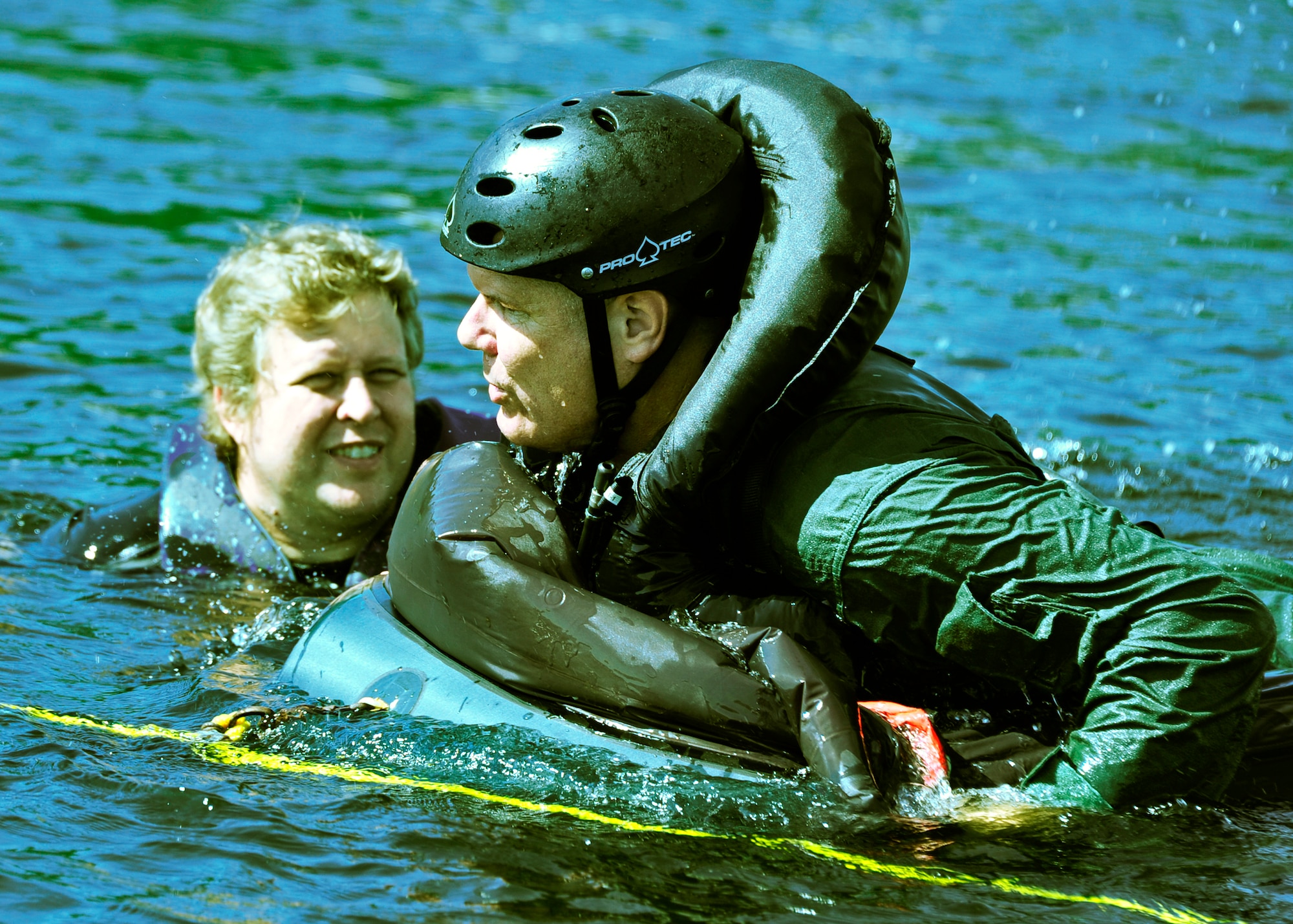 Chief Master Sgt. John Milam, the 53rd Wing command chief, raises himself onto a raft during water survival training at Post’l Point, Sept. 26. Designed for training pilots in the use of water survival equipment after an ejection over the sea or an emergency landing, the exercises provide an interactive environment for community members to work with Airmen. The honorary commander program pairs civic leaders and wing leadership together to exchange ideas and educate civilians about Air Force life. The 53rd Wing currently has 11 honorary commanders. (U.S. Air Force photo/Randy Gon)