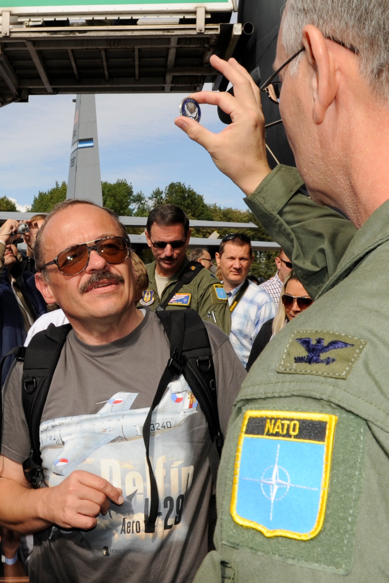 Col. Joseph Jones, the 307th Bomb Wing vice commander presents a challenge coin to the head of the Junior Modelers of the “ALCA” Club, Sazava, Czech Republic during the NATO Days 2012 Air Show Sept. 23. A model of a B-17 Flying Fortress was presented to the 307 BW at the air show. The club honors past members of the 20th Bomb Squadron who flew that namesake aircraft in World War II. (U.S. Air Force photo by Senior Master Sgt. Jessica D’Aurizio/Released)