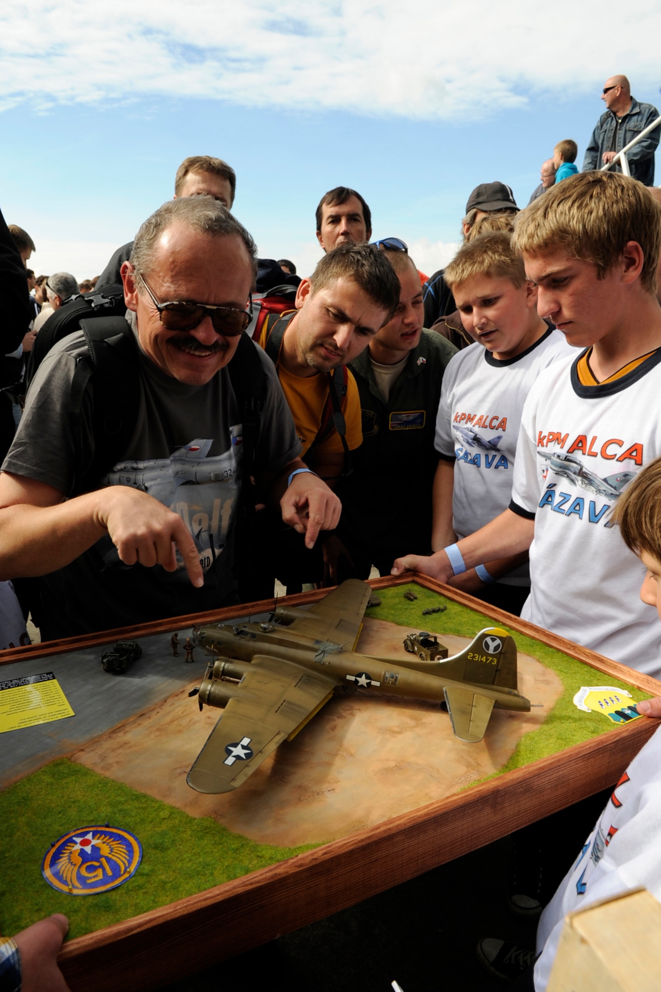The Junior Modelers of the “ALCA” Club, Sazava, Czech Republic present a B-17 Flying Fortress model they constructed to the 307th Bomb Wing during the NATO Days 2012 Air Show on Sept 23. The club honors past members of the 20th Bomb Squadron who flew that namesake aircraft in World War II. (U.S. Air Force photo by Senior Master Sgt. Jessica D’Aurizio/Released)