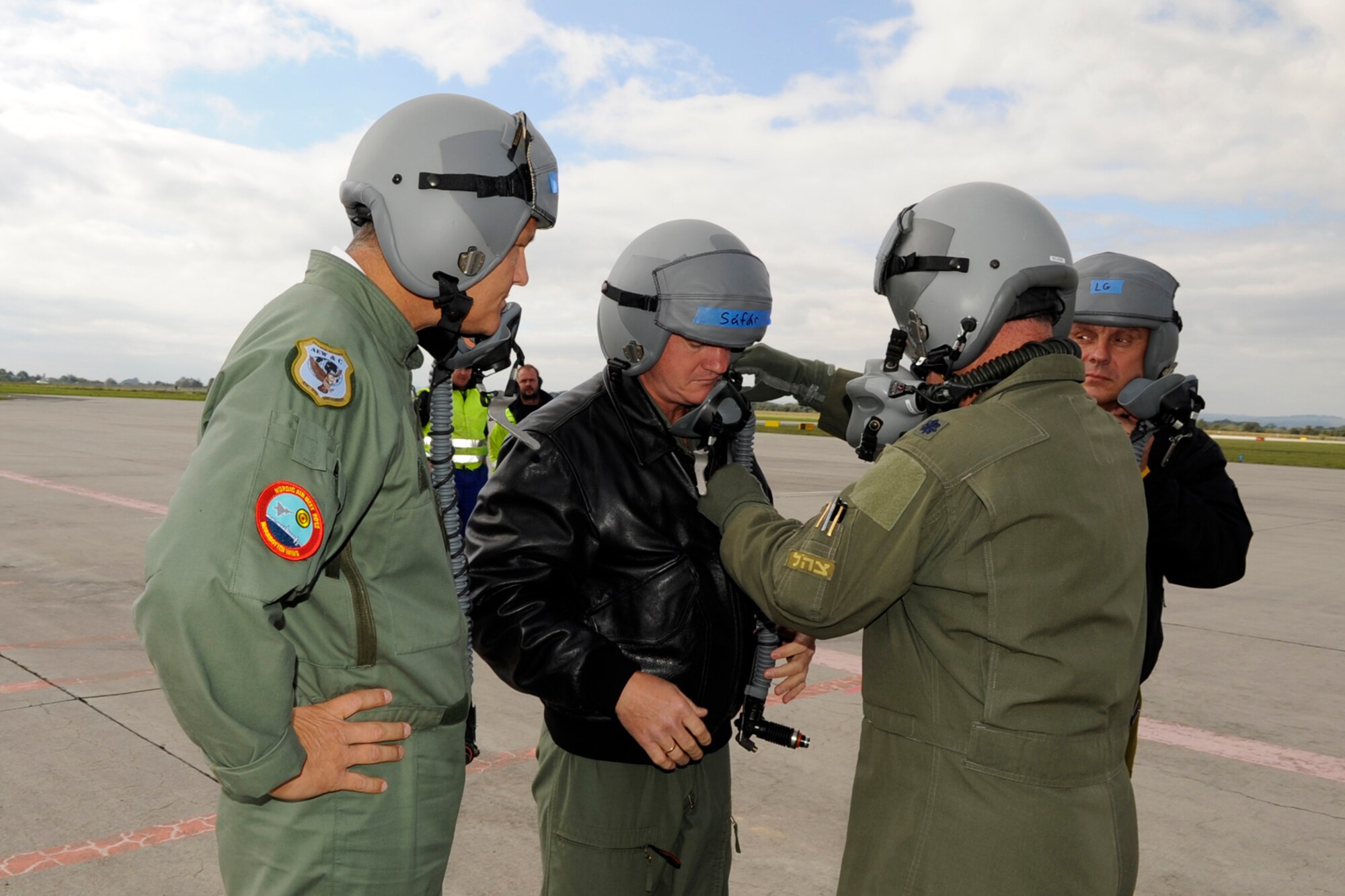 Lt. Col. Dave Webb, the 307th Operations Support Flight commander helps suit up Maj. Gen. Bengt Svensson, Swedish Air Force Chief of Training, Brig. Gen. Albert Safar, Hungarian Air Force Chief of Staff and Brig. Gen. Jiri Verner, Czech Republic Air Force Chief of Staff for a flight in the B-52 Stratofortress during the NATO Days 2012 Air Show at Ostrava, Czech Republic Sept. 22. (U.S. Air Force photo by Senior Master Sgt. Jessica D’Aurizio/Released)