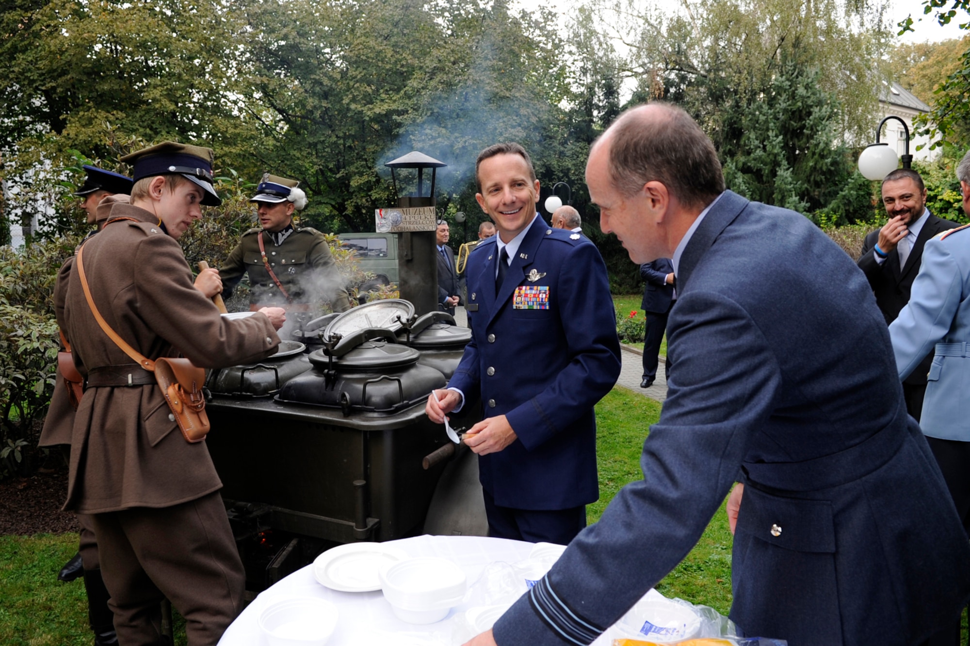 Lt. Col. Denis Heinz, the 343rd Bomb Squadron commander and Squadron Leader Nigel Scopes, Royal Air Force, prepare to sample a meal at the Polish Consulate reception in Ostrava, Czech Republic on Sept. 12, 2012. Commanders from all the countries participating in the NATO Days 2012 were invited to attend the kickoff event. (U.S. Air Force photo by Senior Master Sgt. Jessica D’Aurizio/Released)