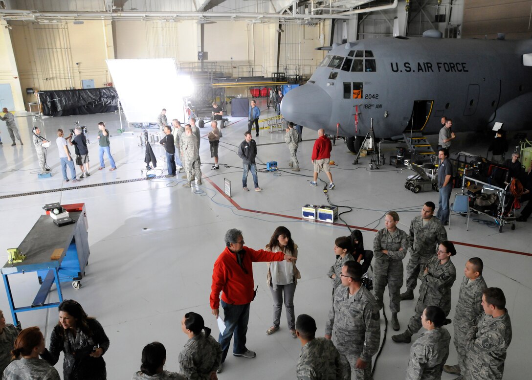 Various members of the 182nd Airlift Wing in Peoria, Ill. are directed and made up to appear in a commercial filmed on Sep. 27, 2012. (U.S. Air Force photo by Tech. Sgt. Todd Pendleton/Released).