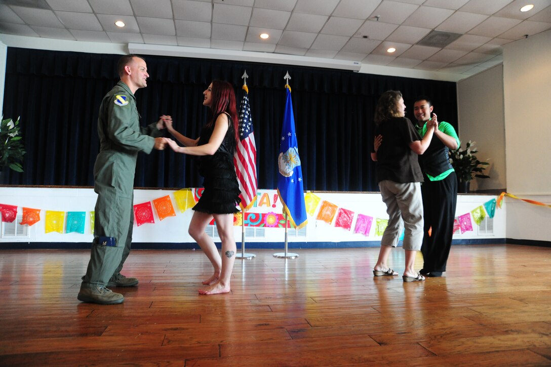 Joint Base Andrews came together to enjoy a Hispanic Heritage-American Month celebration at the community activity center Sept. 21, 2012. The event included a free ethnic-food tasting, a professional dancing demonstration, a live DJ and an opportunity for patrons to dance. (U.S. Air Force photo/Senior Airman Amber Russell)