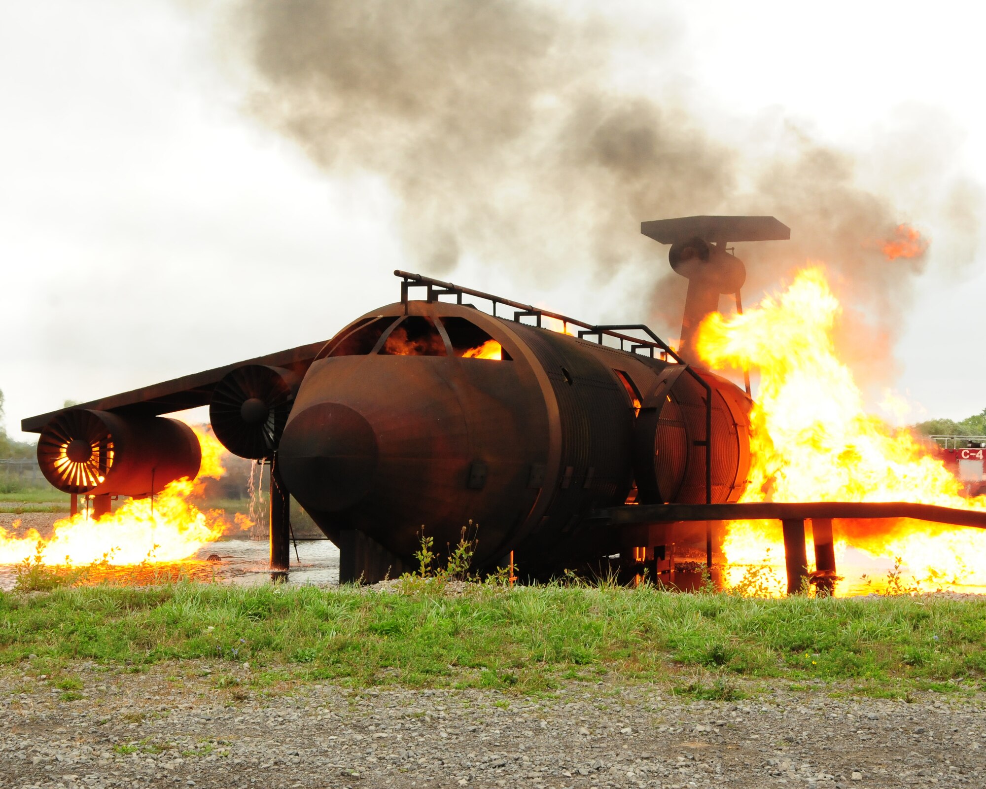 Pictured is a fire demonstration at the training pit on September 26, 2012 at the Niagara Falls Air Reserve Station, N.Y.  Canadian Forces fire officials were here to do a comparative analysis between what the U.S. Air Force is using to train their firefighters compared to what Canadian Forces have. (U.S. Air Force photo by Peter Borys)