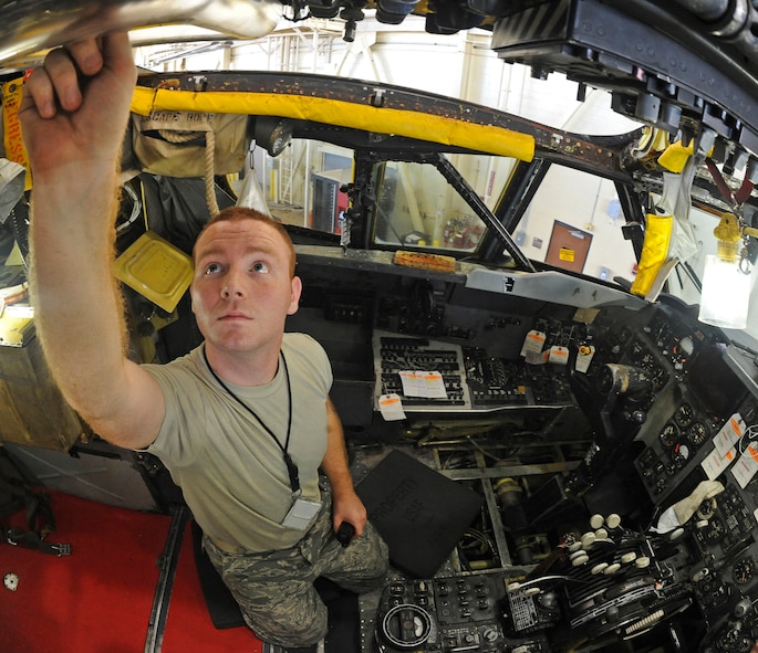 Staff Sgt. Michael Plummer, 2nd Maintenance Squadron communication and navigation mission systems shift supervisor, checks knobs and switches in the flight deck of a B-52H Stratofortress on Barksdale Air Force Base, La., Sept. 25. Every 450 hours, avionics Airmen inspect the B-52 to ensure its avionics systems are working and free of corrosion. (U.S. Air Force photo/Senior Airman Micaiah Anthony)(RELEASED)
