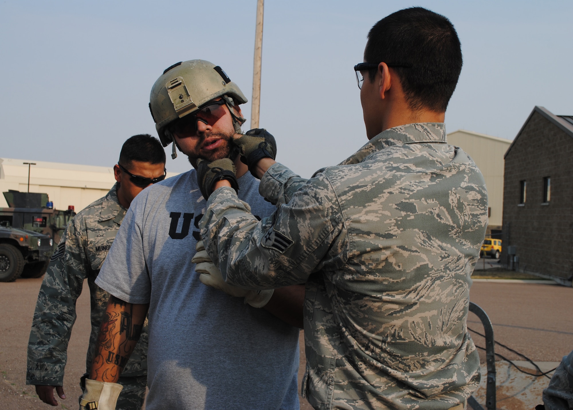 A member of Malmstrom’s 341st SFG TRF fits a helmet on Gonzalez before showing him how they repel down a personnel access hatch at the T-9 trainer on Sept. 25. Gonzalez and Gilyeat had a hands-on chance to try on TRF equipment and partake in SFG training at the T-9 trainer and TRF shoot-house. (U.S. Air Force photo/Airman 1st Class Katrina Heikkinen)