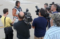 Mike Kirsch, Strongman, speaks to local media outlets Sept. 26, 2012, McConnell Air Force Base, Kan. Kirsch will attempt to break another record during the Wings Over McConnell Open House Air Show Sept. 29 and 30, 2012. (U.S. Air Force photo/Airman 1st Class Jose L. Leon)
