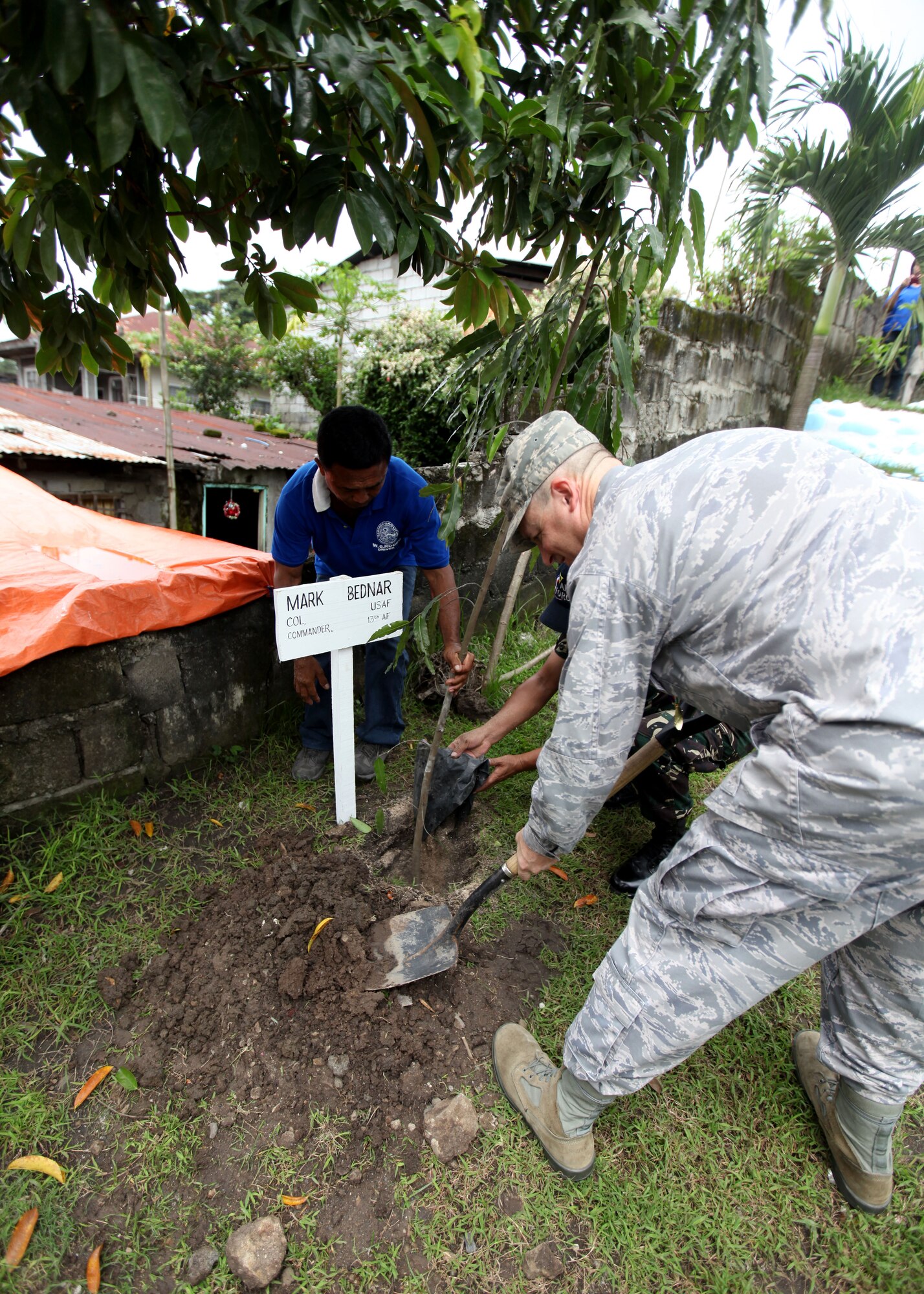 U.S. Air Force Col Mark Bednar plants a tree in his
honor during a dedication ceremony at Clark Air Force
Base, Republic of the Philippines on September 20,
2012. U.S. Air Force Civil Engineering Squad 647 out of
Joint Base Pearl Harbor teamed up with the Republic of
the Philippines Air Force to build an addition onto a
local schoolhouse before dedicating it to the
community. The U.S. military and Republic of the
Philippines military work together to strengthen
interoperability between the Philippine and U.S.
government. (U.S. Marine Corps photo by LCpl Katelyn
Hunter/Released).