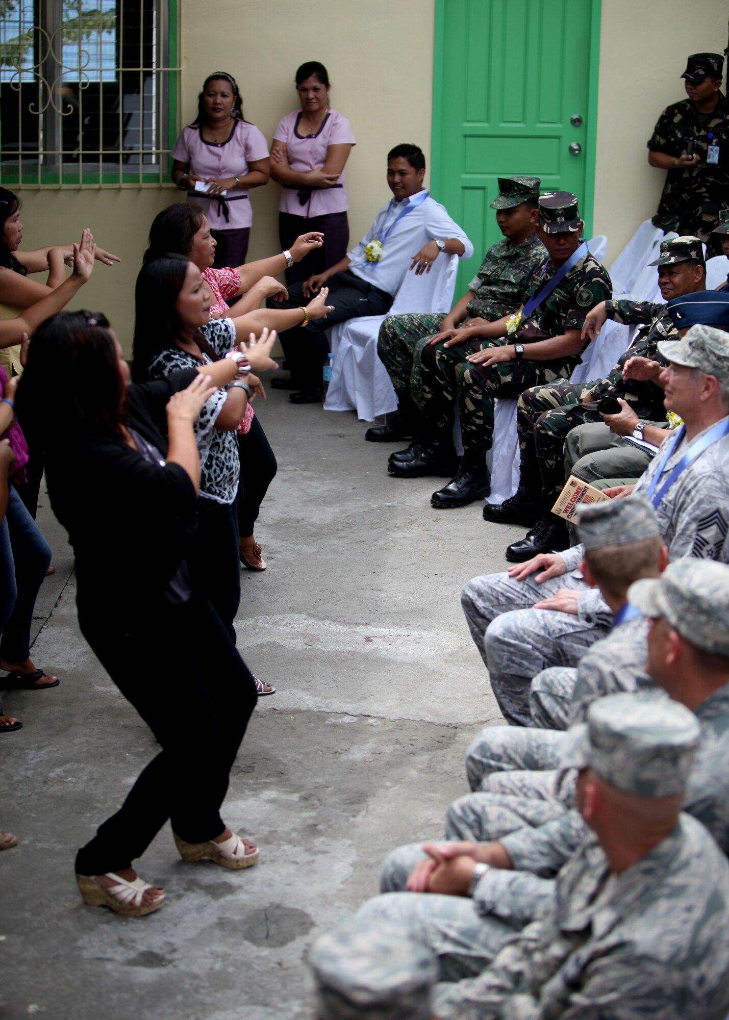 Filipino women show appreciation through dance
during a dedication ceremony at Clark Air Force Base,
Republic of the Philippines on September 20, 2012. U.S.
Air Force Civil Engineering Squad 647 out of Joint Base
Pearl Harbor teamed up with the Republic of the
Philippines Air Force to build an addition onto a local
schoolhouse before dedicating it to the community. The
U.S. military and Republic of the Philippines military
work together to strengthen interoperability between the
Philippine and U.S. government. (U.S. Marine Corps
photo by LCpl Katelyn Hunter/Released).