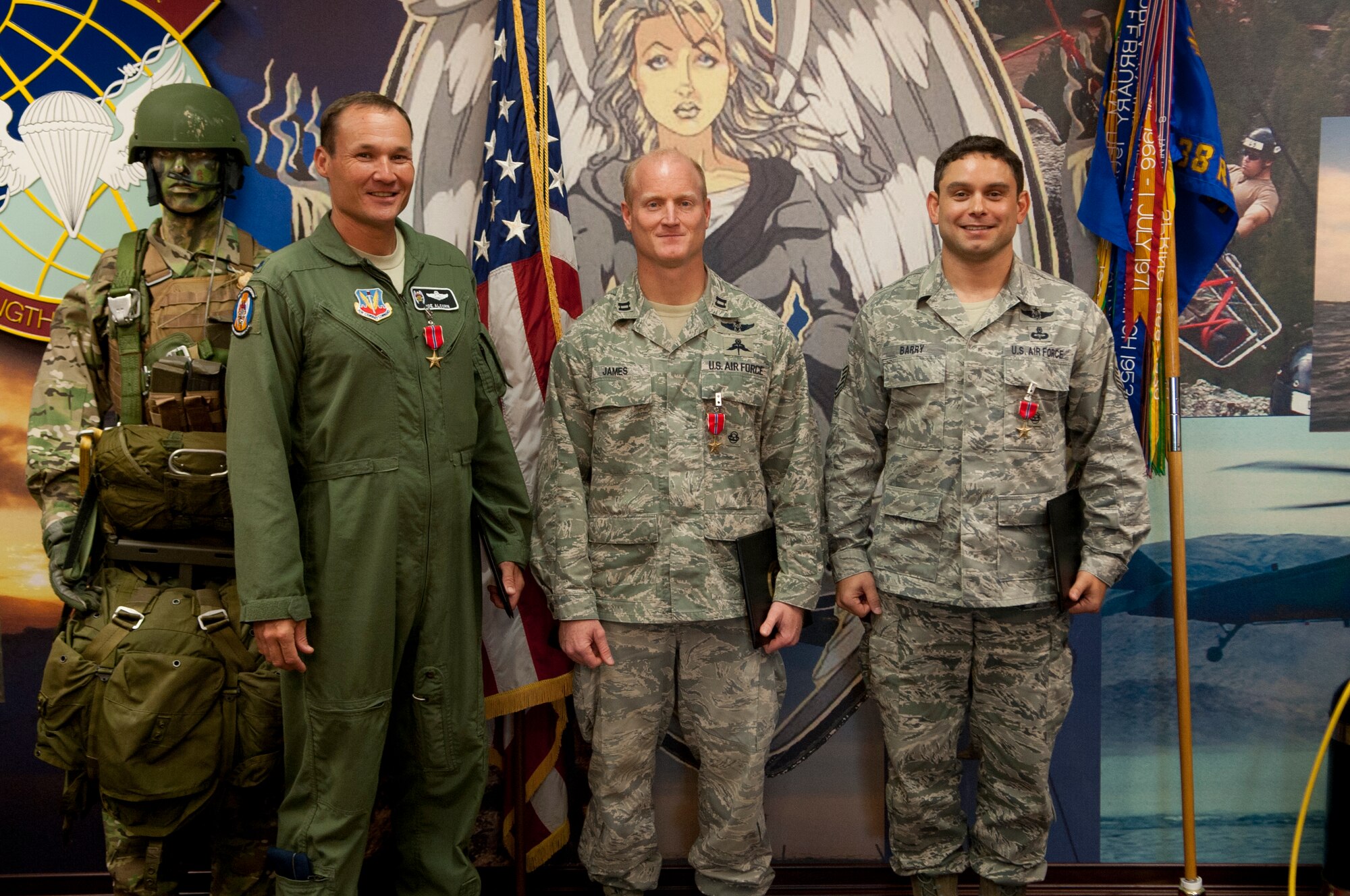 Airmen from the 347th Rescue Group stand at attention after receiving the Air Force Bronze Star Medal during the 347th RQG presentation at Moody Air Force Base, Ga. Sept. 21, 2012.  U.S. Air Force Col. Steven Gregg 347th RQG said “Today we had the honor of presenting three Bronze Star Medals to three outstanding Rescue Airmen. Character is the intersection of courage, integrity, and perseverance, strength of character was the common trait among these leaders and they represent the core of each rescue man to serve our nation honorably”. (U.S. Air Force photo by Airman 1st Class Paul Francis/Released)
