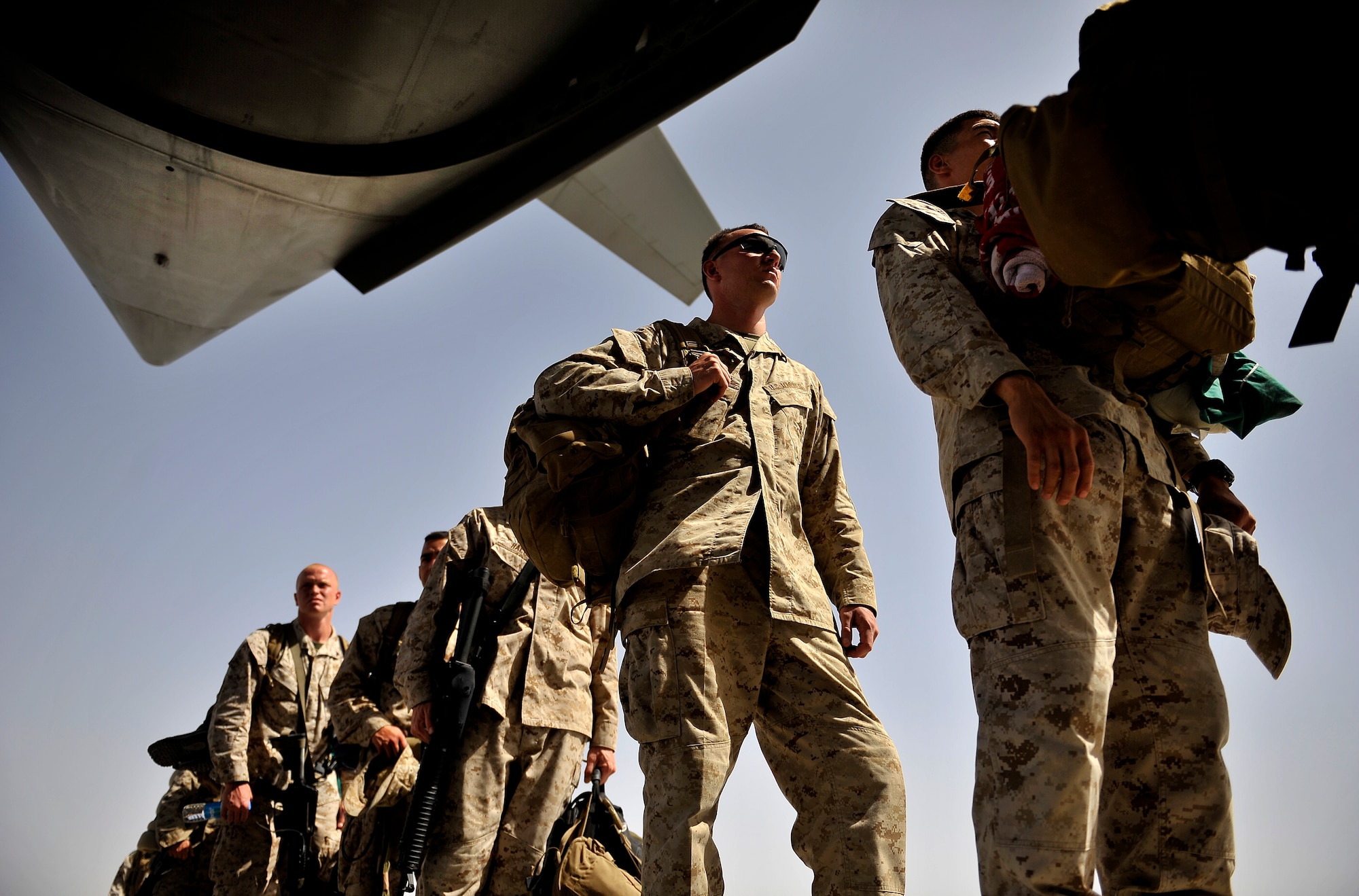 U.S. Marines board an Air Force C-17 Globemaster III during a redeployment mission at Camp Bastion Airfield, Afghanistan, Sept. 11, 2012. The U.S. military is drawing down forces in Afghanistan and redeploying combat forces while transitioning security control to the Afghan National Security Forces. The ANSF and U.S. forces have worked closely and effectively to transition control of security in Afghanistan. (U.S. Air Force photo/Staff Sgt. Clay Lancaster)