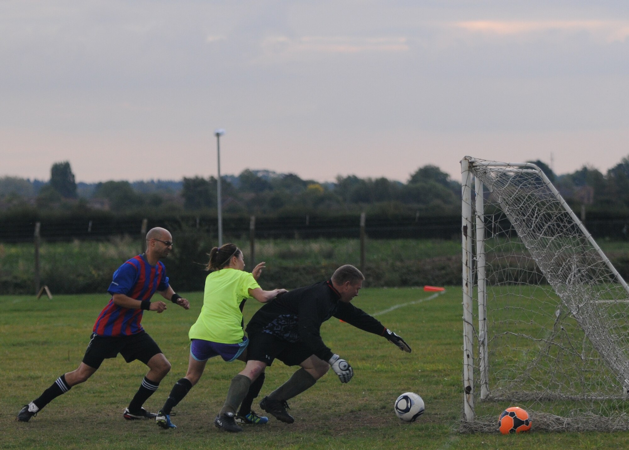 RAF MILDENHALL, England – Tech. Sgt. James Mork, 100th Logistics Readiness Squadron goalie, dives for the ball during an intramural soccer match against the 100th Civil Engineer Squadron Sept. 27, 2012, at RAF Mildenhall, England. (U.S. Air Force photo/Tech. Sgt. Neal X. Joiner)