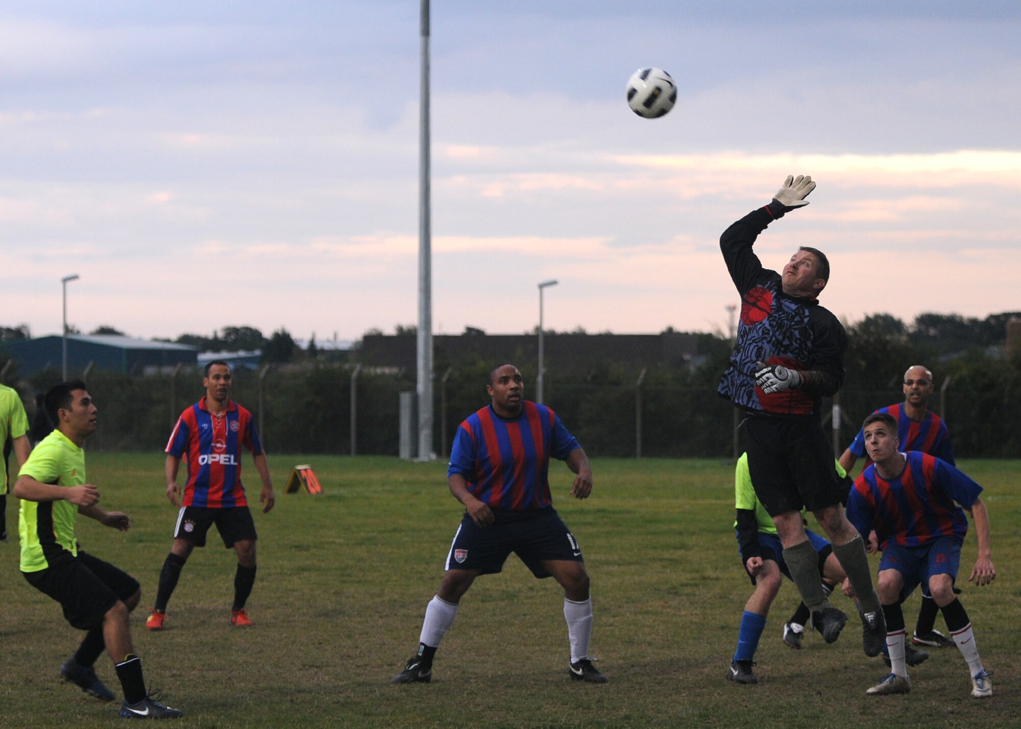 RAF MILDENHALL, England – Tech. Sgt. James Mork, 100th Logistics Readiness Squadron goalie, swats the ball away during an intramural soccer match against the 100th Civil Engineer Squadron at Sept. 27, 2012, RAF Mildenhall, England. (U.S. Air Force photo/Tech. Sgt. Neal X. Joiner)