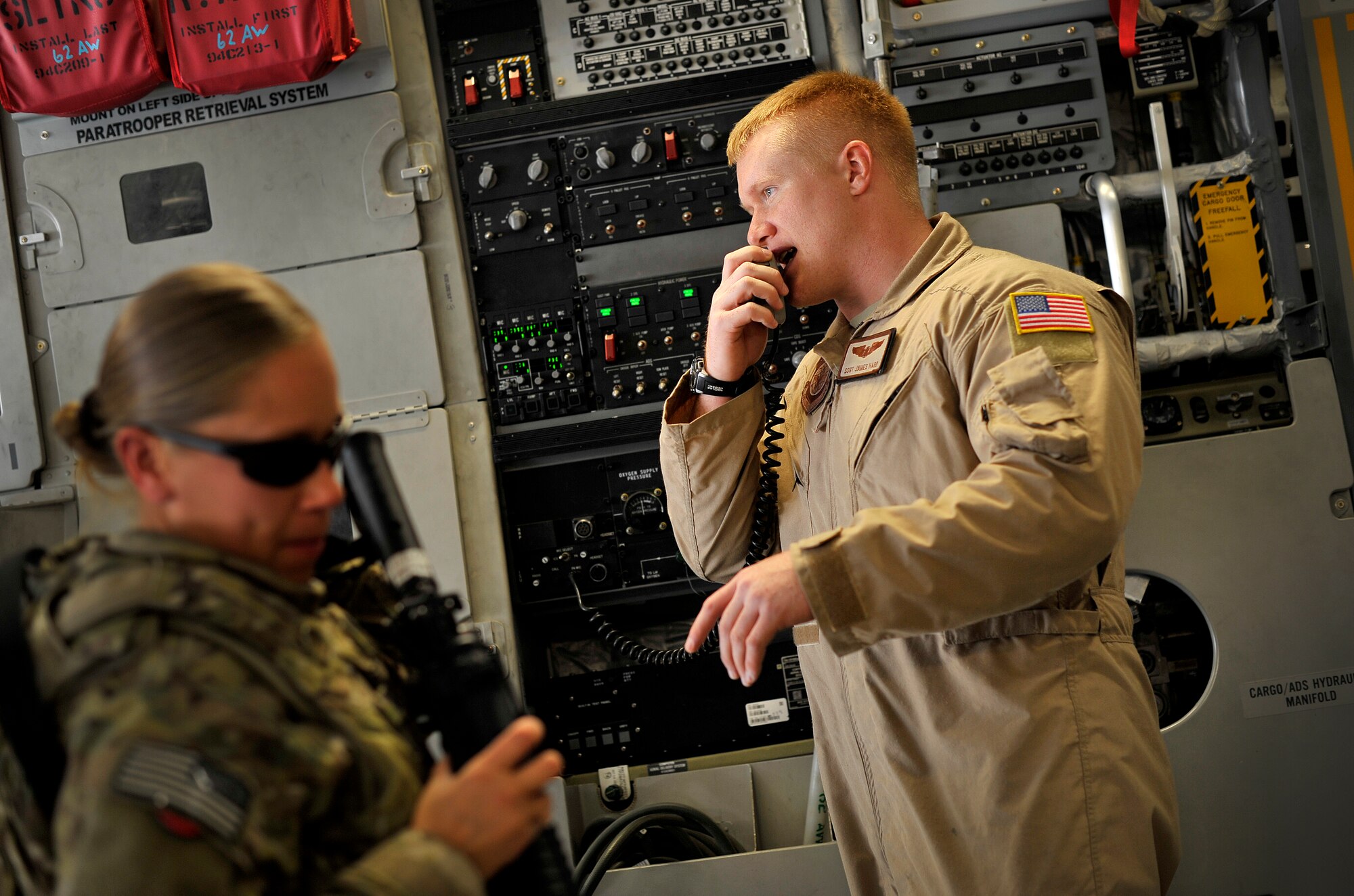 Staff Sgt. James Harp gives instructions to passengers during a redeployment mission headed for Afghanistan, Sept. 15, 2012. Harp is a C-17 Globemaster III loadmaster,  currently part of the 817th Expeditionary Airlift Squadron, deployed to the Transit Center at Manas, Kyrgyzstan. The 817th and their C-17s are an integral piece of the redeployment mission and help to move passengers and cargo within the area of operation. 
