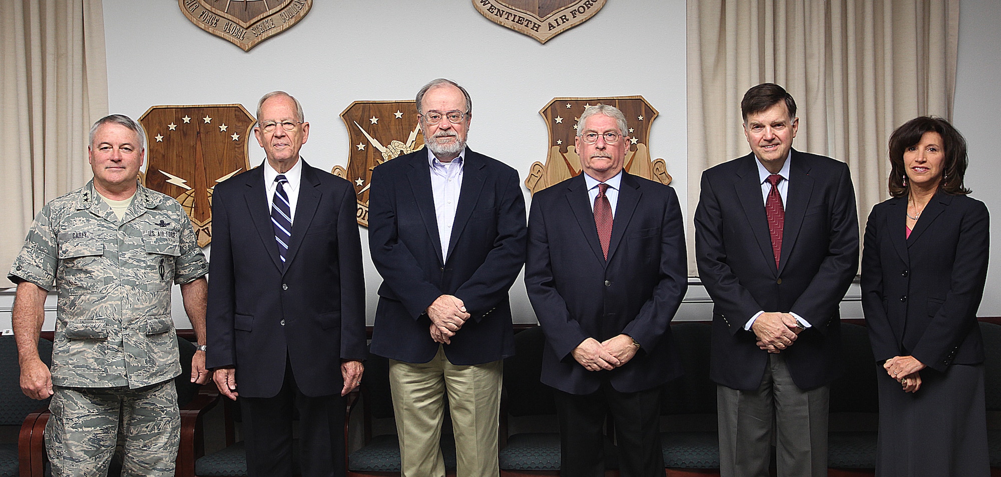 Maj. Gen. Michael J. Carey, 20th Air Force commander, poses for a photograph with retired Gen. Larry Welch, former Air Force Chief of Staff; Dr. Peter Nanos, Johns Hopkins University Applied Physics Laboratory; Dr. Robert Selden, Special Government Employee; Jim Gosler, CIA Clandestine Services; David McDarby, Defense Threat Reduction Agency Nuclear Surety Branch chief; and  Brenda Poole, Senior National Security Specialist, Science Applications Internal Corporation, prior to a Defense Science Board meeting at 20th AF headquarters Sept. 21. (U.S. Air Force photo by Matt Bilden)