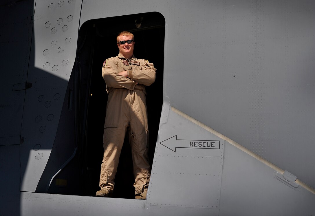 Staff Sgt. James Harp, currently deployed with the 817th Expeditionary Airlift Squadron, Transit Center at Manas, Kyrgyzstan, smiles in the door of a C-17 Globemaster III. Harp is one of several loadmasters contributing to redeployment operations in Afghanistan. Harp heavily relied upon by the squadron as a loadmaster evaluator and has been in the Air Force for six and a half years. (U.S. Air Force photo/Staff Sgt. Clay Lancaster/ Released) 
