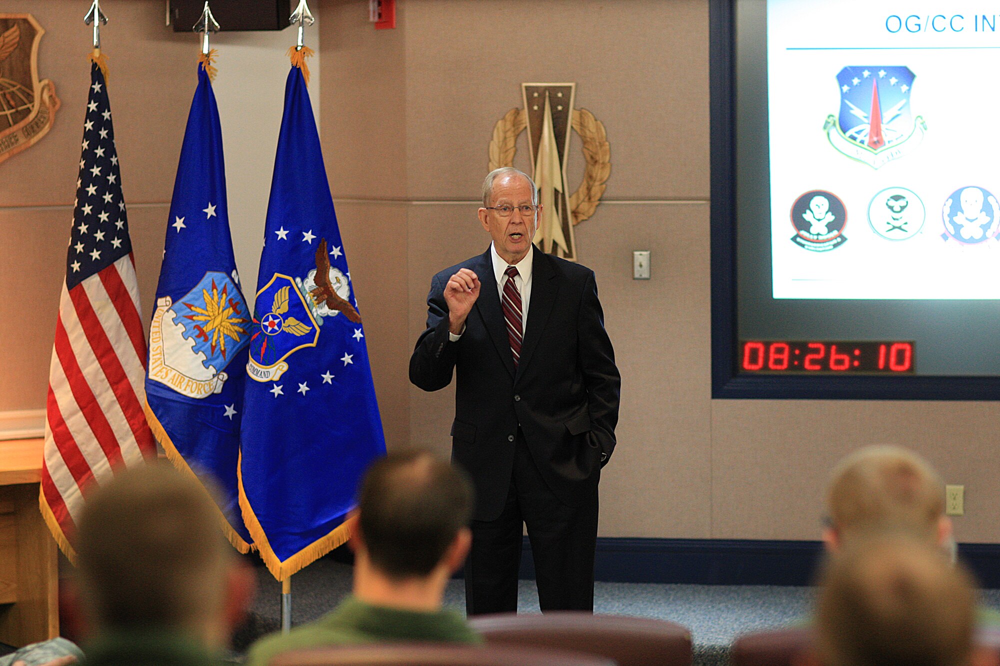 Retired Gen. Larry Welch, former Air Force Chief of Staff, speaks during a 90th Operations Group mass briefing in the 90th OG building during the Defense Science Board visit Sept. 20. (U.S. Air Force photo by Matt Bilden)