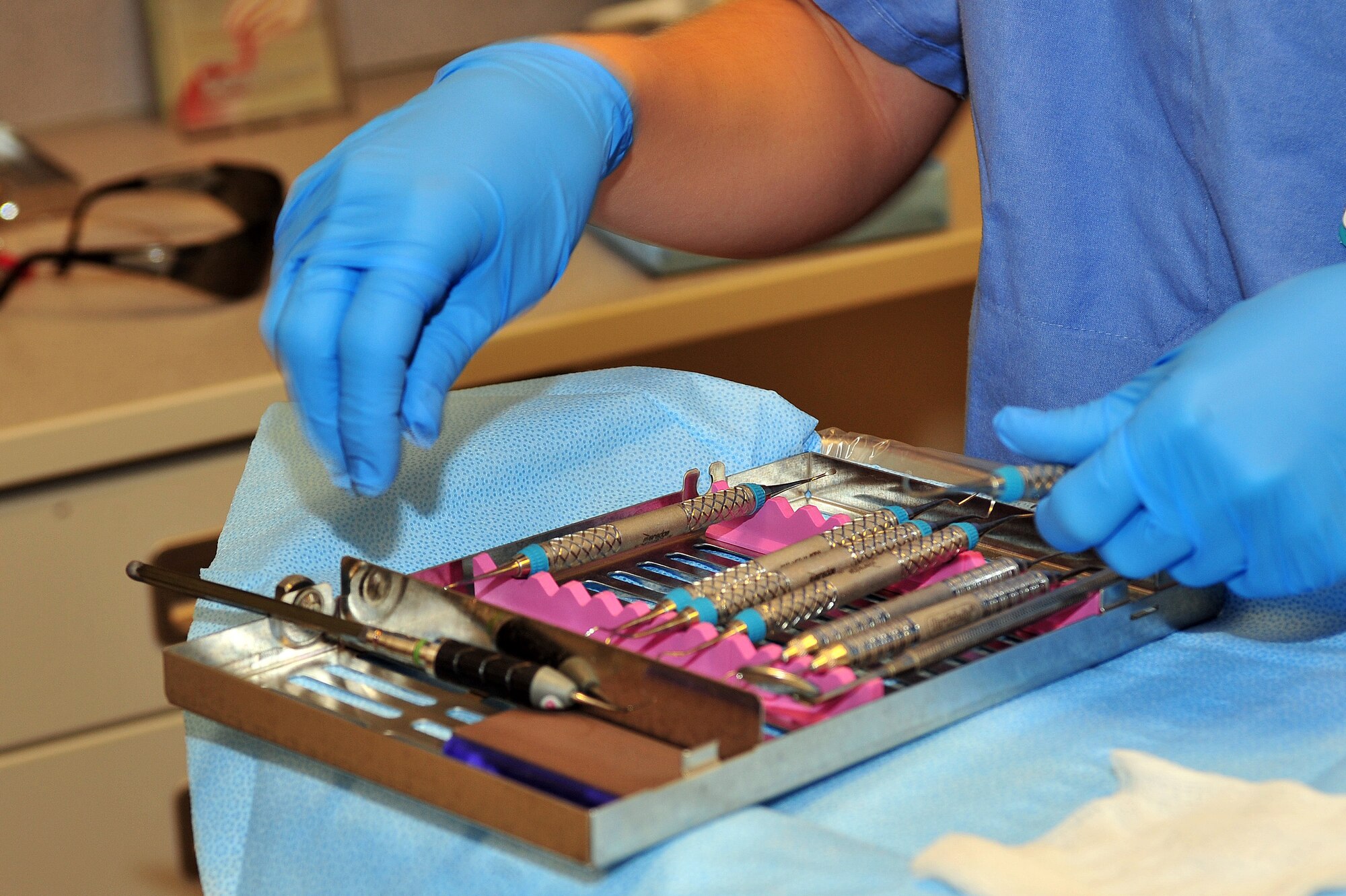 U.S. Air Force Staff Sgt. Cami Richards, 355th Dental Squadron dental assistant, looks through a kit to find the right tool on Davis-Monthan Air Force Base, Ariz., Sept. 25, 2012. (U.S. Air Force photo by Airman 1st Class Josh Slavin/Released)
