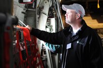 An attendee admires the view through the window of a C-130 H Hercules aircraft during an orientation flight, Sept. 26. The flight was part of a tour for Boy Scouts of America leadership and community members belonging to judicial offices designed to build advocacy for the Air Force Reserve and inform attendees on the mission and capabilities of the 910th Airlift Wing. U.S. Air Force photo by Mr. Eric M. White.