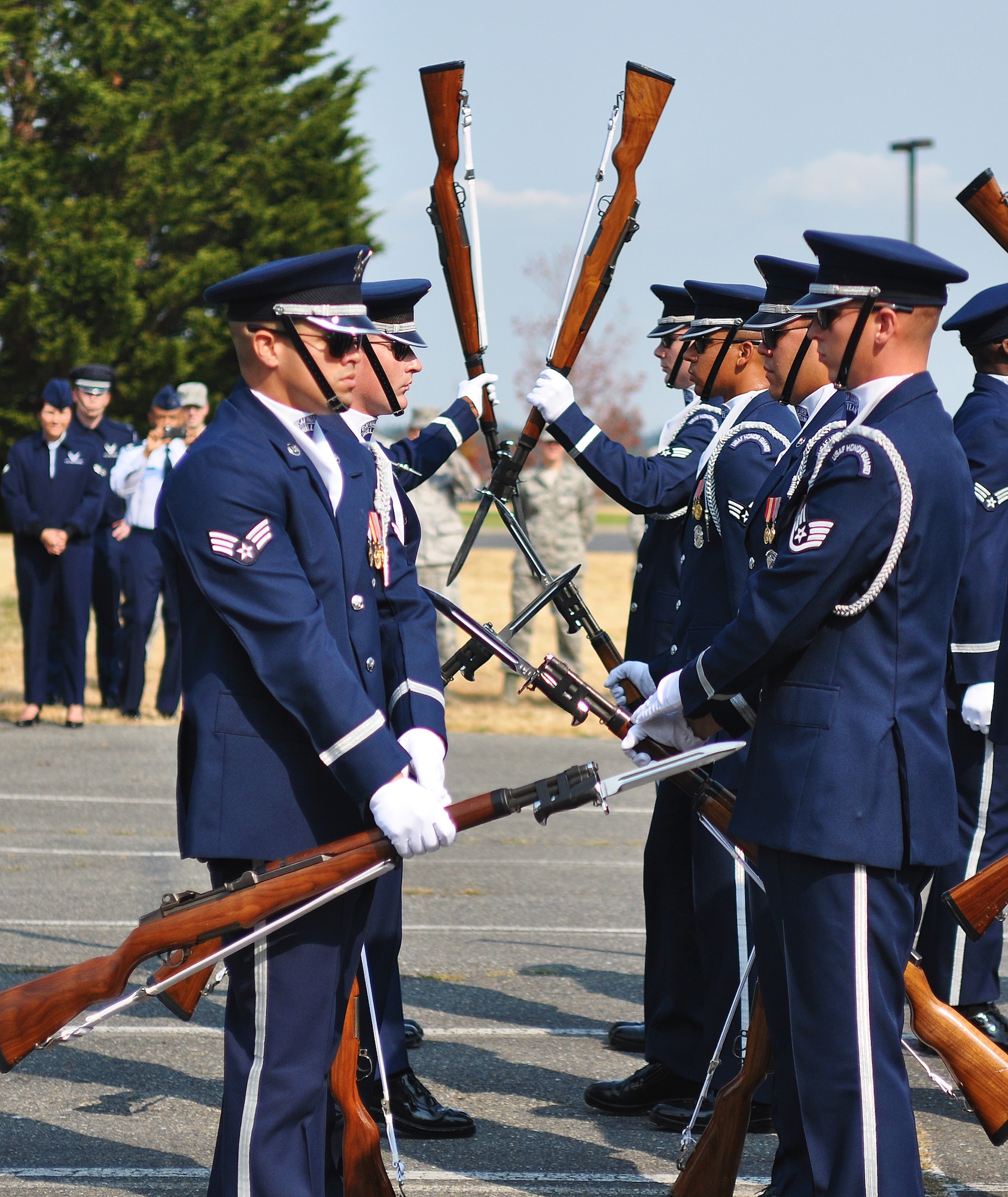 Members of the U.S. Air Force Honor Guard drill team perform harrowing movements with their M-1 Garand rifles with bayonets affixed, Sept 24, 2012, at Joint Base Lewis-McChord, Wash. The team stopped at JBLM on their tour around the country and performed many demonstrations around the area. (U.S. Air Force photo/Staff Sgt. Sean Tobin)