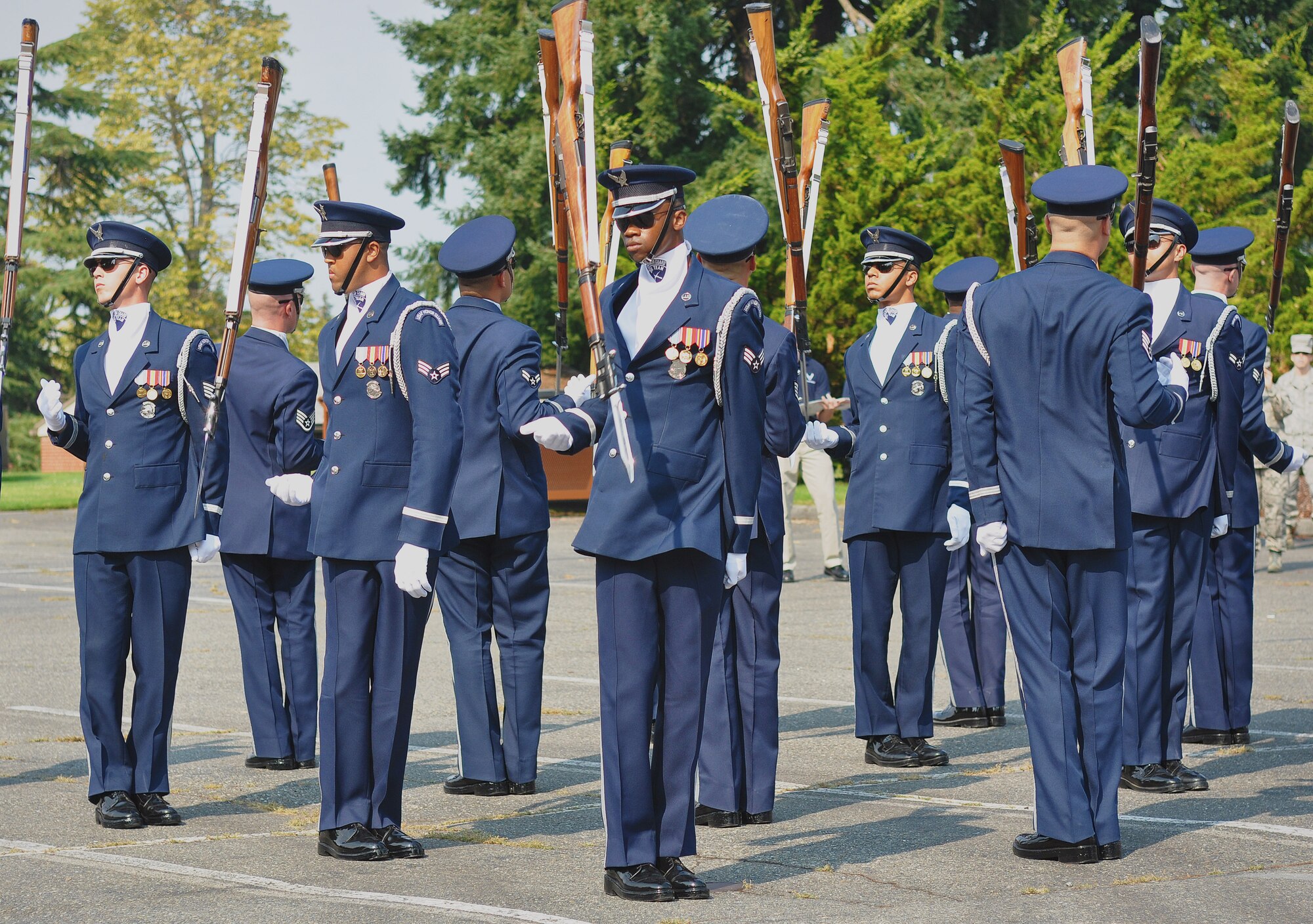 Members of the U.S. Air Force Honor Guard drill team perform for onlookers, Sept. 24, 2012, at Joint Base Lewis-McChord, Wash. The team stopped at JBLM on their tour around the country and performed many demonstrations around the area. (U.S. Air Force photo/Staff Sgt. Sean Tobin)